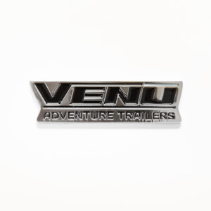 VENŪ Chrome Logo Plate