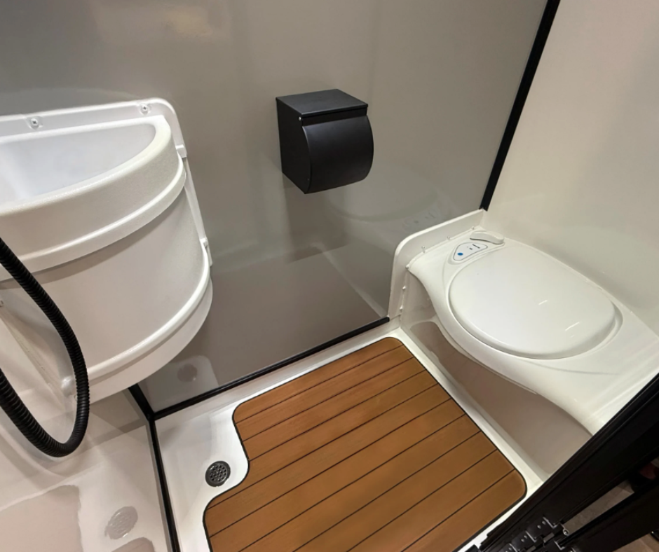 Wet Bath With Toilet, Sink, and Shower